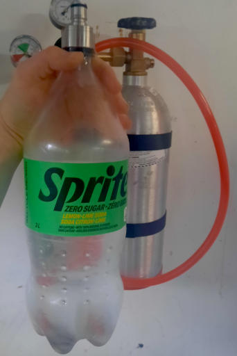 A picture of a carbonated bottle of soda